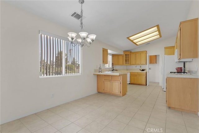 19115 Seneca, Apple Valley, CA 92307 - kitchen featuring a chandelier, lofted ceiling, a peninsula, white dishwasher, and hanging light fixtures