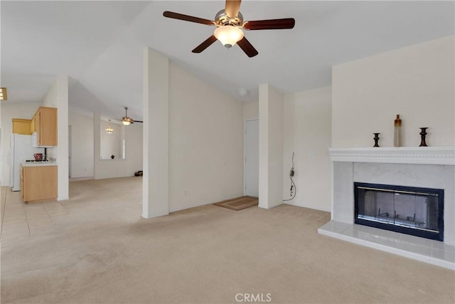 19115 Seneca, Apple Valley, CA 92307 - unfurnished living room with vaulted ceiling, a ceiling fan, light colored carpet, and a tile fireplace