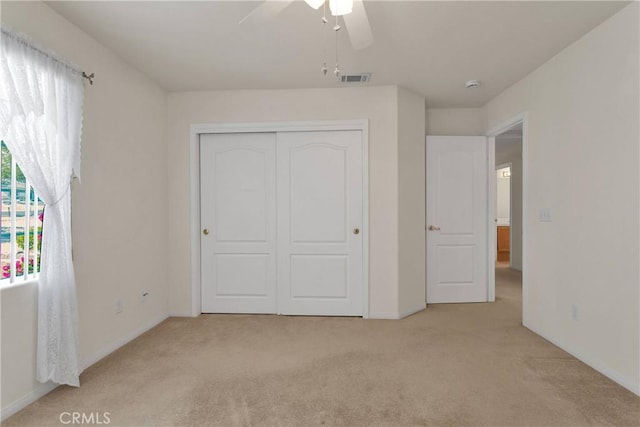 19115 Seneca, Apple Valley, CA 92307 - unfurnished bedroom featuring carpet floors, a closet, baseboards, and a ceiling fan
