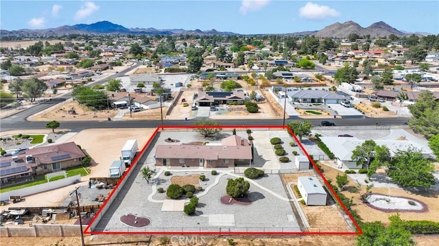 19115 Seneca, Apple Valley, CA 92307 - aerial view of residential area featuring a mountain backdrop and property parcel outlined