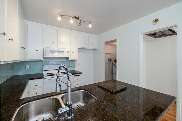 2900 Madison Ave Unit D16, Fullerton, CA 92831 - kitchen with white appliances, a sink, white cabinets, and dark stone counters