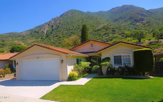 6464 San Como Ln, Camarillo, CA 93012 - mediterranean / spanish home with a mountain view, a garage, stucco siding, driveway, and a tiled roof