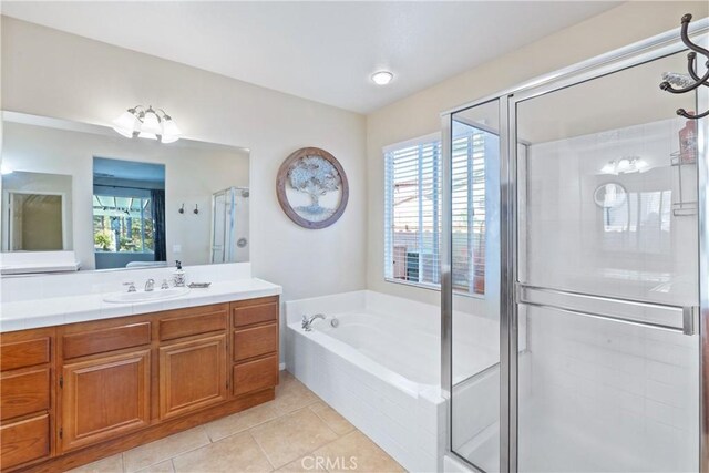 35475 Calendula Cir, Winchester, CA 92596 - bathroom featuring a garden tub, tile patterned floors, a stall shower, and plenty of natural light