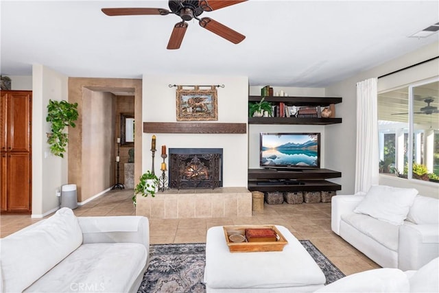 35475 Calendula Cir, Winchester, CA 92596 - living area featuring a ceiling fan, light tile patterned flooring, and a warm lit fireplace