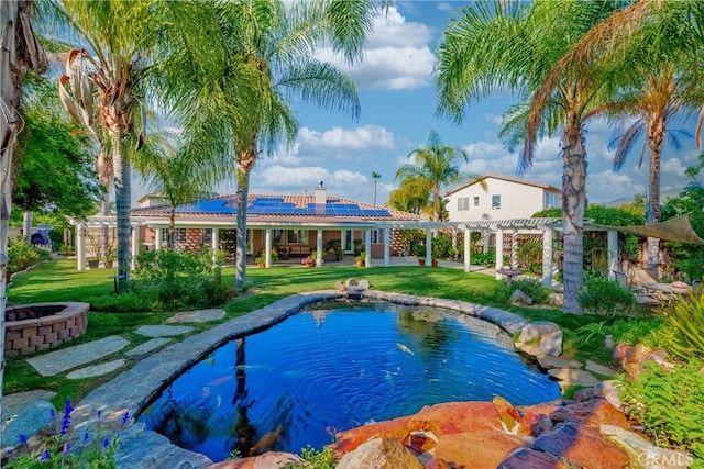 35475 Calendula Cir, Winchester, CA 92596 - swimming pool featuring a fire pit, a pergola, a lawn, and a patio