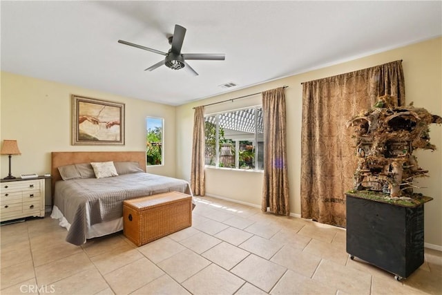 35475 Calendula Cir, Winchester, CA 92596 - bedroom with light tile patterned flooring, a ceiling fan, and baseboards
