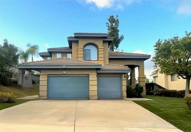 13564 Esprit Ave, San Diego, CA 92128 - mediterranean / spanish home featuring a tile roof, an attached garage, driveway, stucco siding, and a front yard