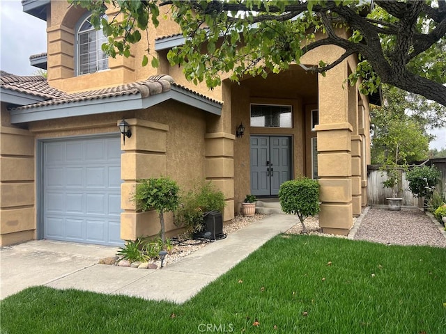13564 Esprit Ave, San Diego, CA 92128 - view of exterior entry featuring stucco siding, a tile roof, a garage, and fence