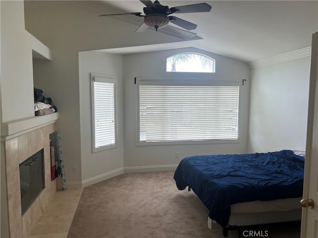 13564 Esprit Ave, San Diego, CA 92128 - bedroom featuring lofted ceiling, multiple windows, a fireplace, light colored carpet, and a ceiling fan