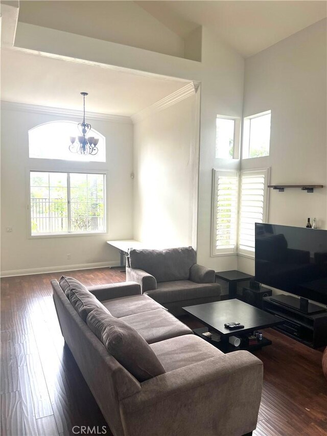 13564 Esprit Ave, San Diego, CA 92128 - living area featuring a chandelier, crown molding, plenty of natural light, and wood-type flooring