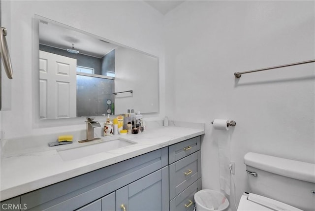 1451 W 10th St, Pomona, CA 91766 - bathroom with toilet, vanity, and an enclosed shower