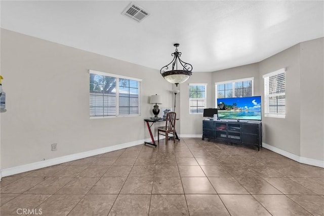 1451 W 10th St, Pomona, CA 91766 - living area featuring tile patterned flooring and baseboards