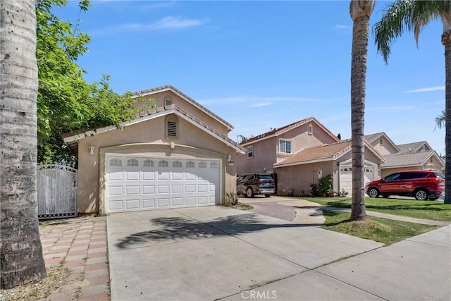1451 W 10th St, Pomona, CA 91766 - view of front of property featuring concrete driveway and stucco siding