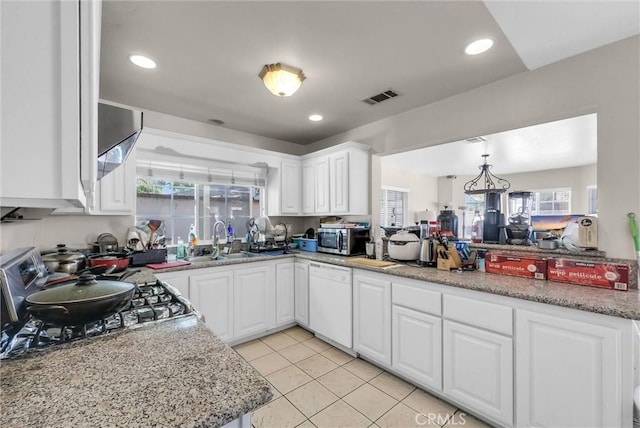 1451 W 10th St, Pomona, CA 91766 - kitchen featuring dishwasher, a sink, stainless steel microwave, white cabinets, and light tile patterned flooring