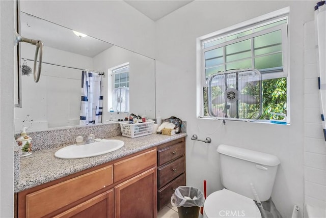 1451 W 10th St, Pomona, CA 91766 - bathroom with healthy amount of natural light, toilet, a shower with shower curtain, and vanity