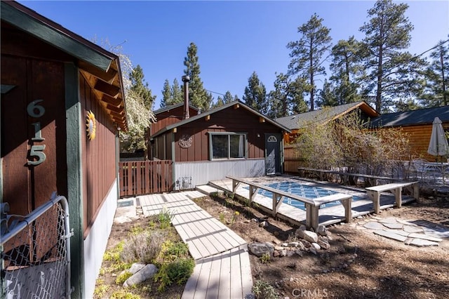 615 Elysian Blvd, Big Bear City, CA 92314 - back of house with fence and a pool