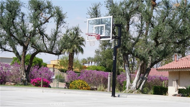 view of sport court with community basketball court and fence