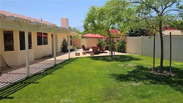 view of yard with a patio and a pergola