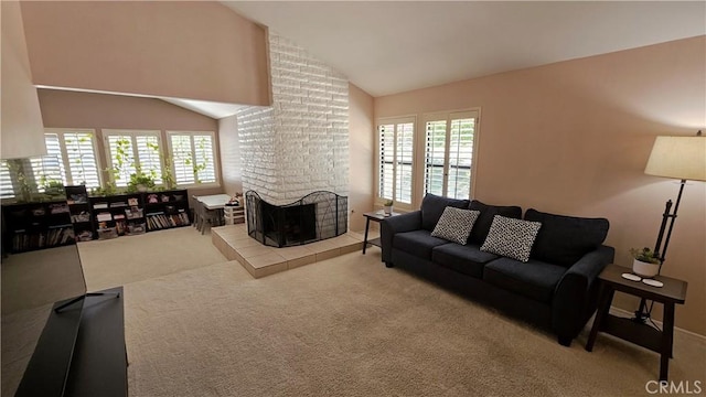 carpeted living area featuring vaulted ceiling and a fireplace