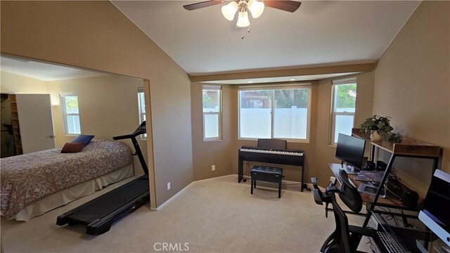 bedroom with carpet flooring, baseboards, lofted ceiling, and a ceiling fan