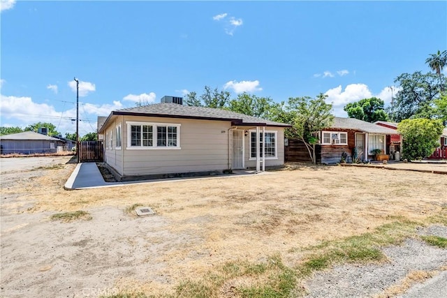 109 Lorita Way, Hanford, CA 93230 - rear view of property featuring fence and central AC unit