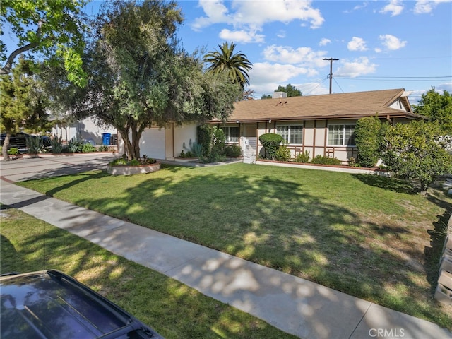 11242 Kamloops St, Sylmar, CA 91342 - ranch-style home with stucco siding, a front lawn, and a garage