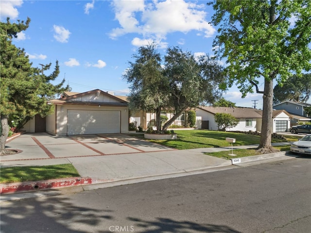 11242 Kamloops St, Sylmar, CA 91342 - ranch-style home featuring a front lawn, concrete driveway, and a garage