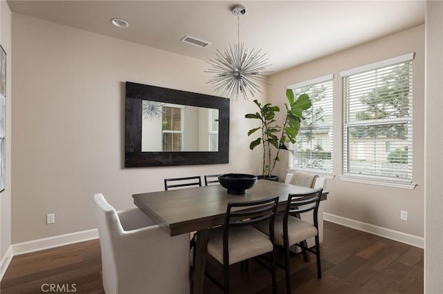 dining area with a chandelier, dark wood finished floors, baseboards, and recessed lighting