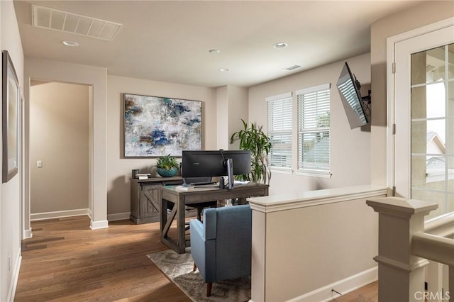 home office featuring baseboards, wood finished floors, and recessed lighting