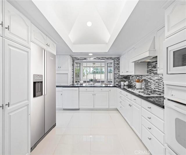 20720 Cottonwood Rd, Yorba Linda, CA 92887 - kitchen featuring white appliances, dark countertops, white cabinets, light tile patterned floors, and recessed lighting