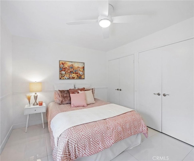 20720 Cottonwood Rd, Yorba Linda, CA 92887 - bedroom featuring multiple closets, light tile patterned floors, and a ceiling fan