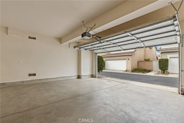 2535 Canterbury Ln, Simi Valley, CA 93063 - garage featuring a garage door opener and baseboards