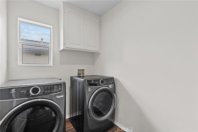 2535 Canterbury Ln, Simi Valley, CA 93063 - laundry room featuring washer and clothes dryer, cabinet space, dark wood-style floors, and baseboards