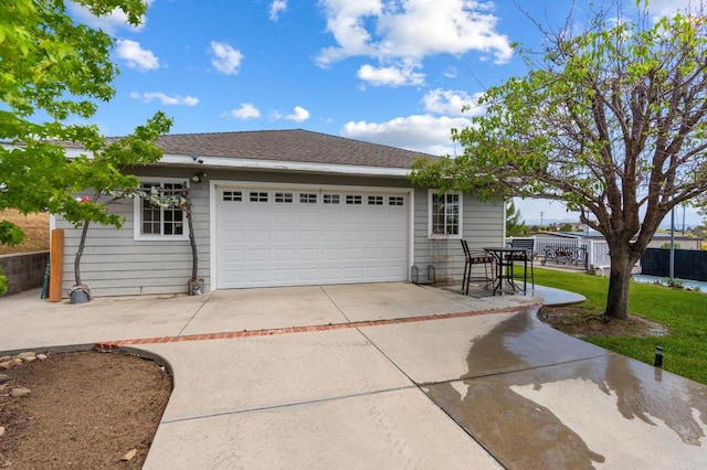 view of front of home with driveway and an attached garage