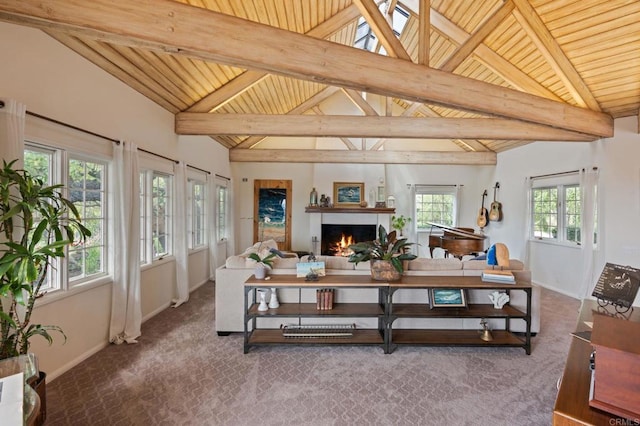 carpeted living room with wooden ceiling, a warm lit fireplace, and baseboards