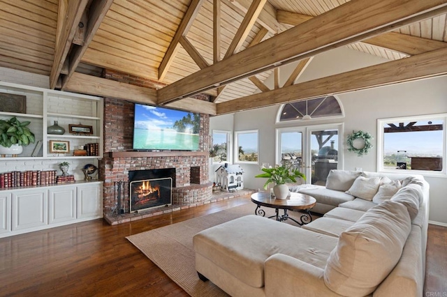 living room with wood ceiling, wood finished floors, a brick fireplace, and healthy amount of natural light