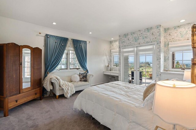 bedroom with access to outside, carpet flooring, recessed lighting, french doors, and wallpapered walls