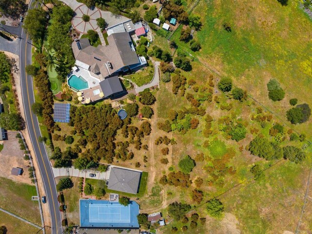 view of property location with a pool