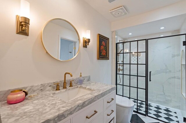 bathroom featuring a shower stall, toilet, vanity, and recessed lighting