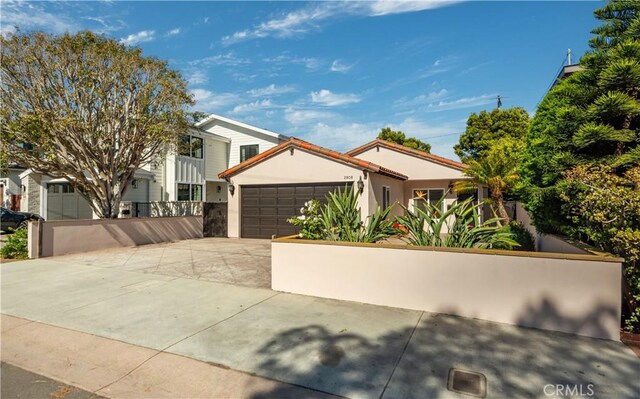 2808 Oak Ave, Manhattan Beach, CA 90266 - view of front facade featuring concrete driveway, an attached garage, stucco siding, and fence