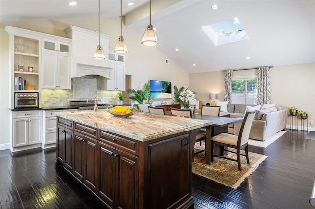 2808 Oak Ave, Manhattan Beach, CA 90266 - kitchen featuring white cabinetry, dark wood-type flooring, beam ceiling, tasteful backsplash, and glass insert cabinets