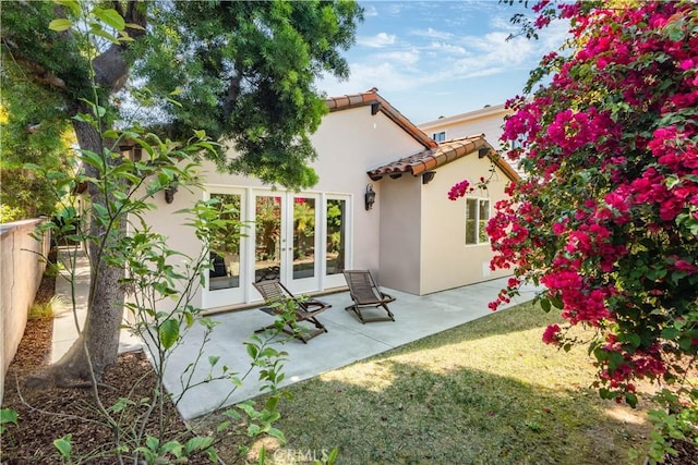 2808 Oak Ave, Manhattan Beach, CA 90266 - back of property with french doors, a tile roof, stucco siding, and a patio
