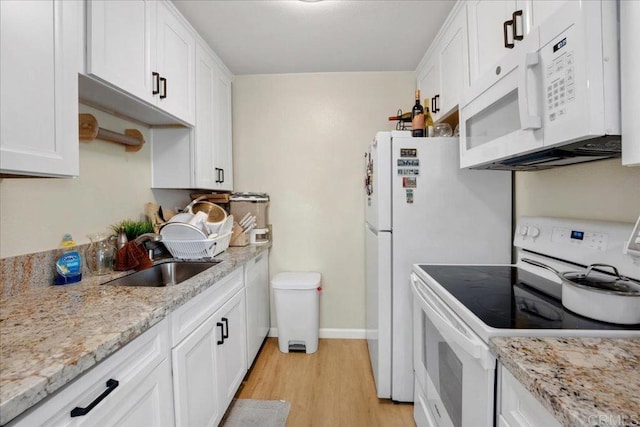 8102 Winter Gardens Blvd Unit 5, Lakeside, CA 92040 - kitchen featuring white appliances, light wood finished floors, white cabinetry, and light stone countertops