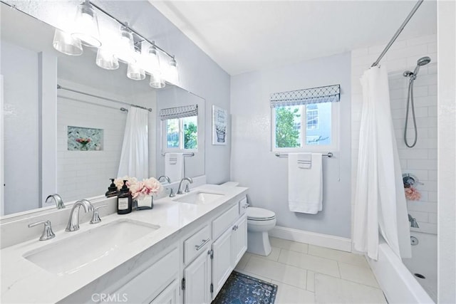 bathroom featuring plenty of natural light, toilet, shower / bath combo with shower curtain, and double vanity