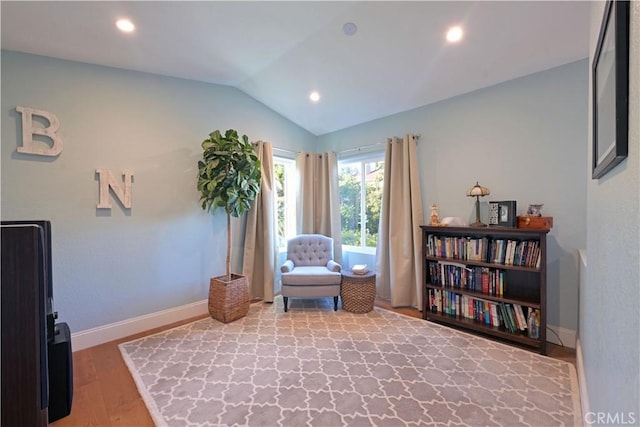 sitting room with vaulted ceiling, wood finished floors, baseboards, and recessed lighting