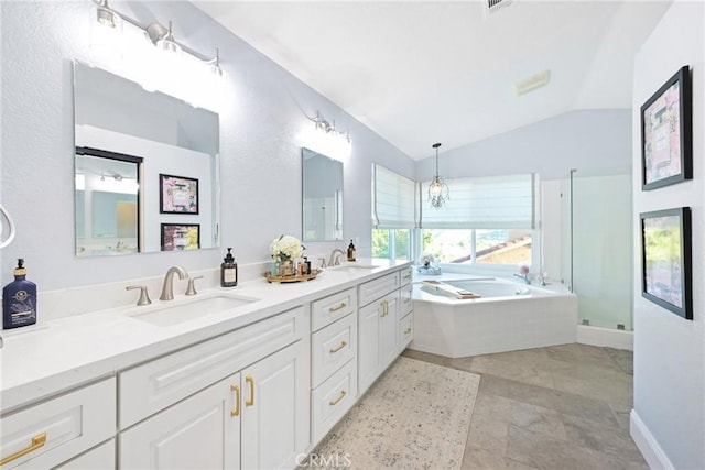 bathroom featuring lofted ceiling, a garden tub, double vanity, and a shower with door