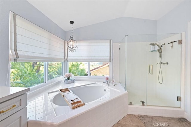 full bathroom featuring a bath, vaulted ceiling, a shower stall, and vanity