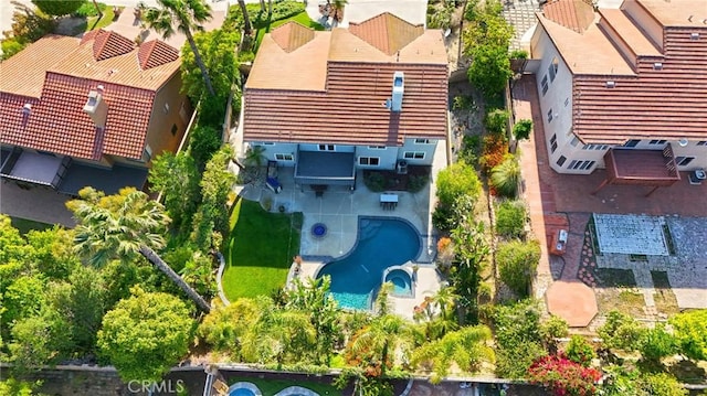 aerial view of residential area featuring a pool
