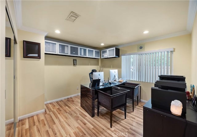 office space featuring ornamental molding, light wood finished floors, baseboards, and recessed lighting