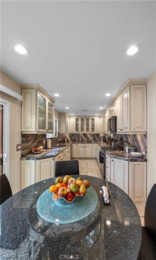 dining space featuring recessed lighting